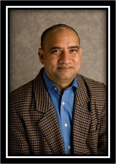 faculty member, Osman Patel, smiling